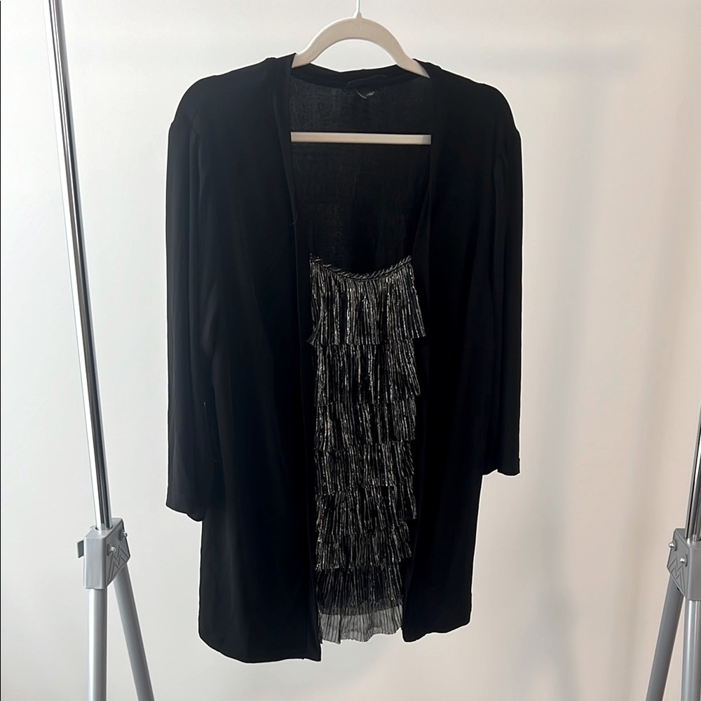 3/4 sleeve lightweight top with metallic ruffle inset.